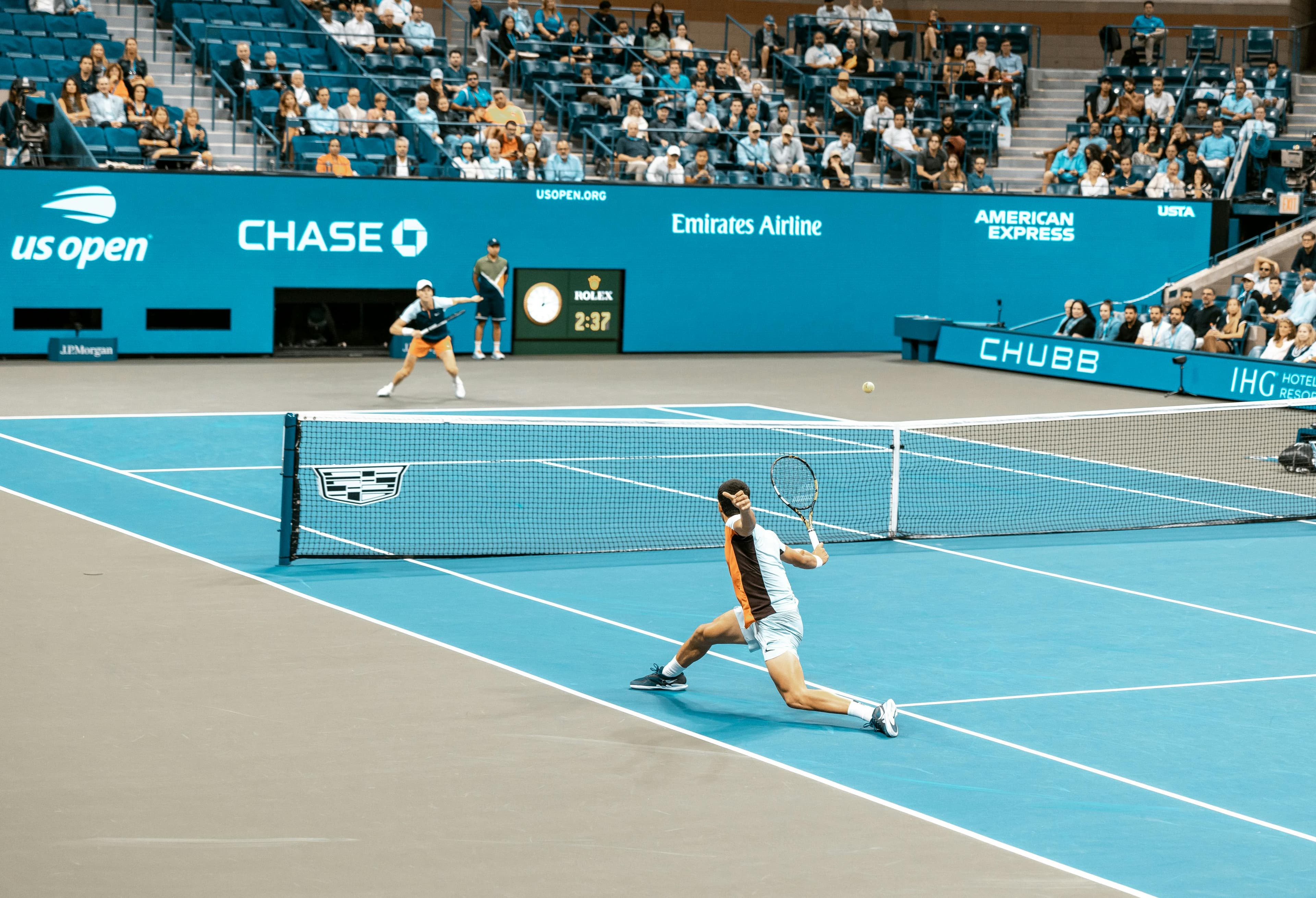 Tennis player preparing to serve